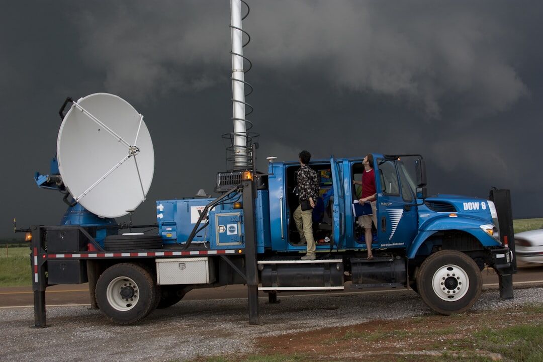 Outside broadcast truck with satellite dish parked for a live report